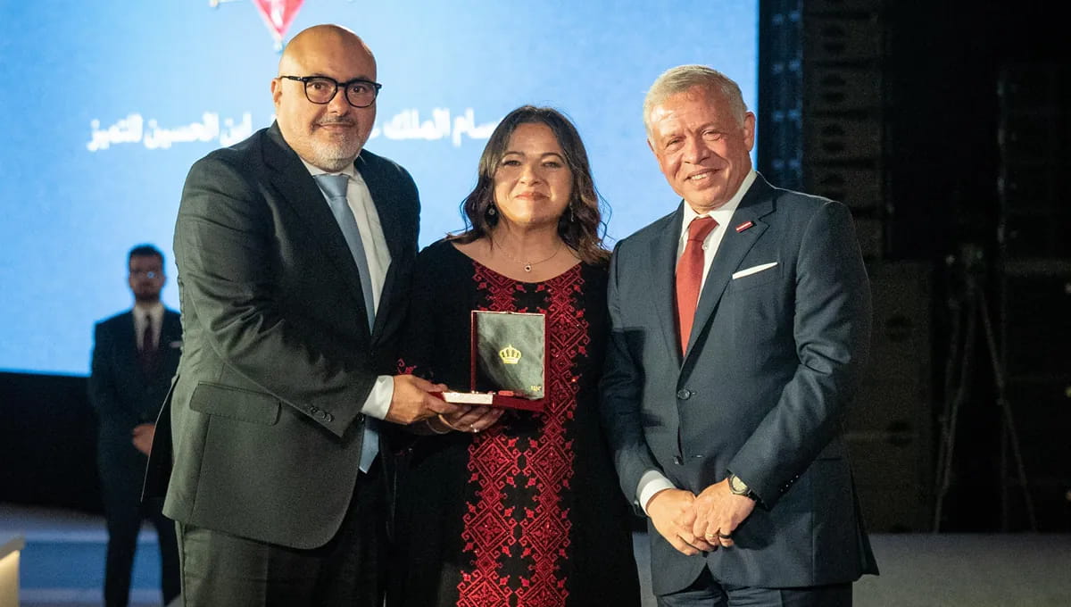 His Majesty King Abdullah II with Shadi Sharaiha and Cynthia Madanat Sharaiha, who hold the Order for Excellence.