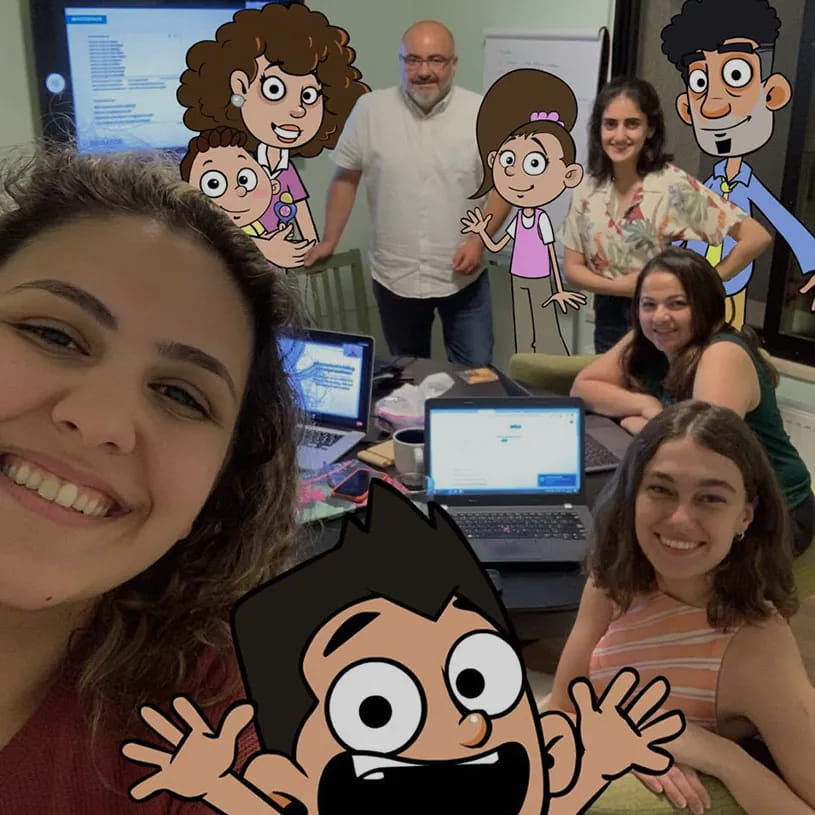 The team taking a selfie with their 2D cartoon characters drawn in.