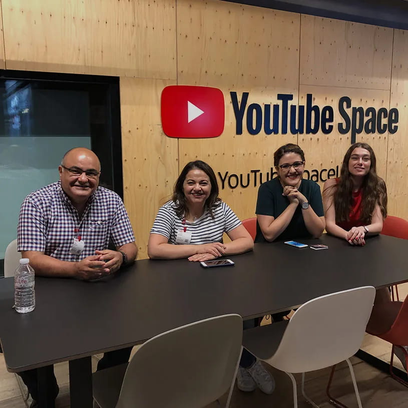 Four team members at a table at YouTube Space.
