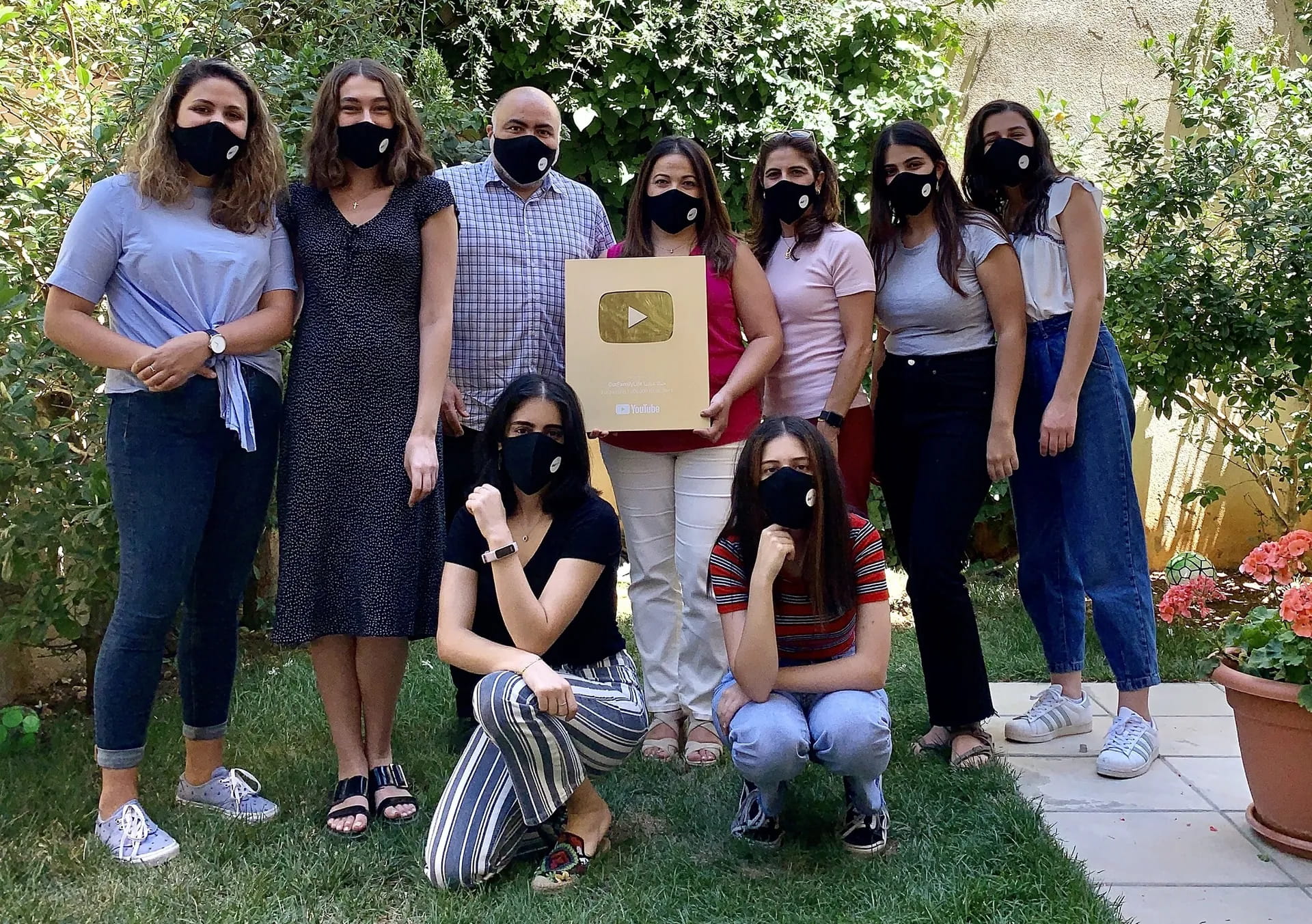 The Digitales team celebrating with the YouTube Gold Play Button plaque.